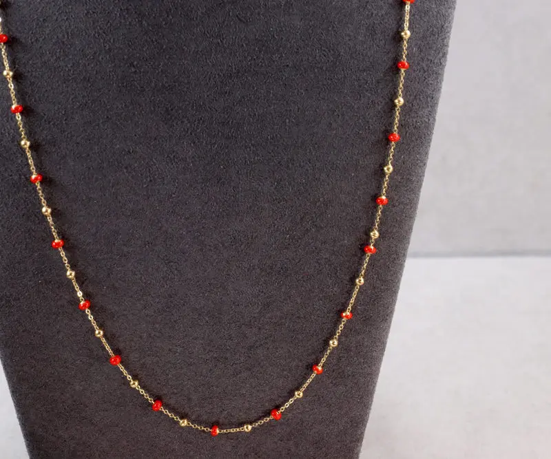 Collier boules d'or et boules émail orange